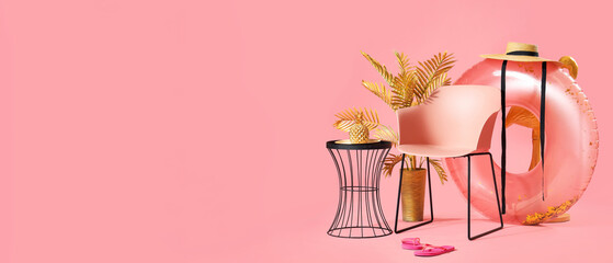 Composition with chair, different decorations and beach accessories on pink background. Travel...