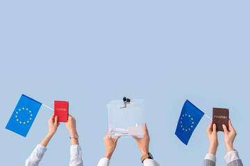 Hands holding ballot box, passports and EU flags on light background. Election concept
