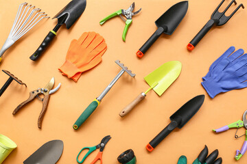 Gardening supplies on orange background. Top view