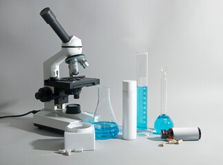 laboratory microscope on gray background 