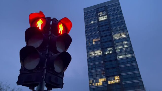 traffic light works at night time, close-up. night city traffic control. full cycle from red to green signal
