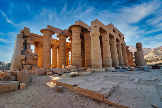 View of the main hypostyle gallery of the Ramesseum, the Mortuary Temple of Pharoah Ramesses II the Great on a bright afternoon with blue skies at Luxor, Egypt 