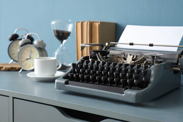 Vintage typewriter on table in office, closeup