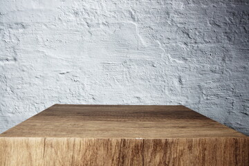 Empty wooden podium stand for display products front of concrete background