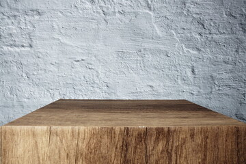 Empty wooden podium stand for display products front of concrete background