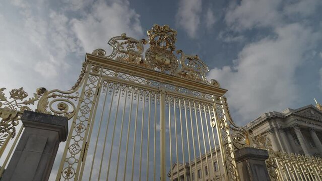 Versailles, France - Marble sculpture and The Royal Gate of the Palace of Versailles