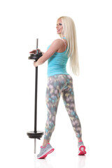 smiling sporty woman exercising with barbell