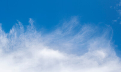 Large white clouds. Sky with fluffy white cloudscape texture. Wide blue sky nature background,...