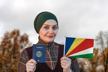 Muslim Woman Holding Passport and Flag of Seychelles
