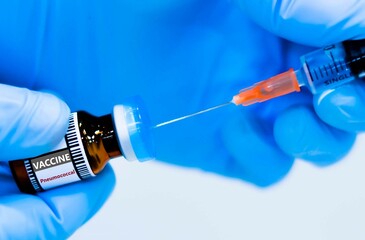 Pneumococcal vaccine bottles and syringes for preventing pneumonia.