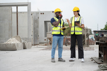 Portrait African engineer man use clipboard and Hispanic latin engineer woman use tablet computer...