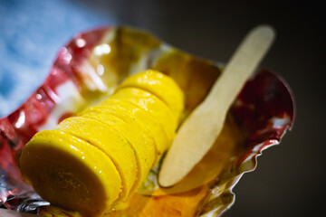 Malai kesar kulfi is an Indian ice cream made of milk, saffron and dry fruits. This frozen dessert is served on a plate for consuming