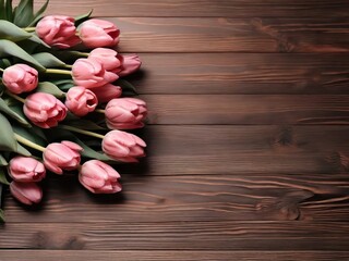 pink tulips lie on the left on a wooden background, there is a writing box to the right