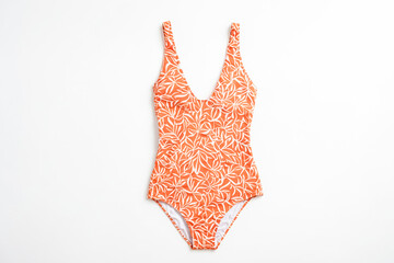 Orange floral swimsuit on white background