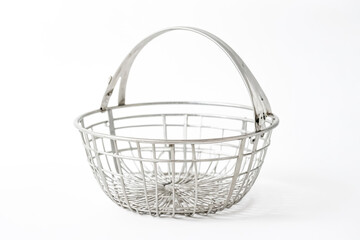 Obraz premium Silver metal basket with handle on white background