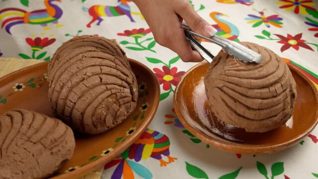 traditional chocolate-flavored Mexican bread, known as conchas, on a Mexican table