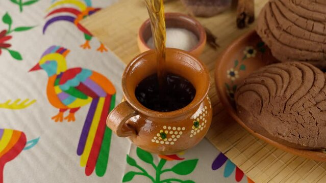 pouring coffee into a clay cup, hot coffee on a cold afternoon