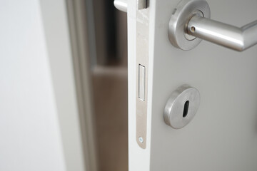 open door concept with Door handle and blur interior room background,