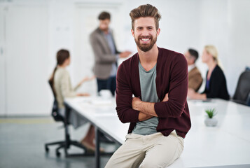 Business, man and portrait in office with creative people, happy employee and company goals with vision for growth. Coworking, workplace and meeting discussion, project manager and male person