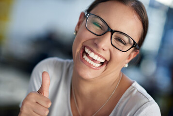 Happy, business woman and hand with thumbs up for good job, praise or feedback in office. Corporate...