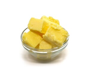 Closeup of Milk Butter in a Small Glass Bowl Isolated on White Background with Copy Space