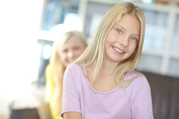 Portrait, home and mother with girl, relax and bonding together with happiness, childhood and peace. Face, single parent and joyful family with mama, daughter and kid in living room, calm and smile