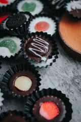 Stack of vegan chocolate cups with caramel on white tabletop. Homemade vegetarian chocolate caramel cups. Ideas and recipes for healthy sweets and dessert. Selective focus. Copy space for text.