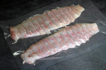 Fresh grouper fish fillets in vacuum package for delicious menu, perfect for a healthy and easy meal.