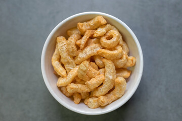 Deep-fried skin pork or crispy pork rinds in a bowl.