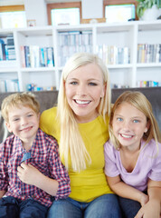 Happy mother, portrait and relax with children for bonding, love or care on holdiay or weekend on...