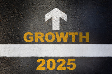 New year 2025 growth and white arrow written on asphalt road surface with white starting lines....