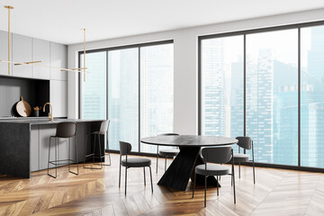 Stylish home kitchen interior with dining table and bar island with window