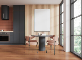 Modern dining area with blank poster, spacious kitchen with wooden floor, bright lighting. Concept...