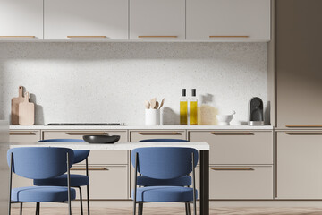 Luxury home kitchen interior with eating table and cabinet with kitchenware