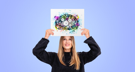 Woman holding poster with a colorful brain with gears, smart concept