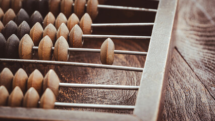 vintage abacus or abacus on wooden background in