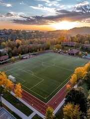 Scenic Autumn Sunset Overlooking a Lush University Soccer Field