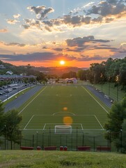 Picturesque Sunset Over a Lush Soccer Field in the Countryside