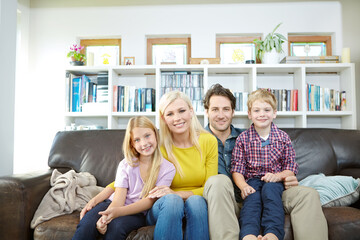 Happy family, portrait and relax on sofa in home with bonding, confidence and resting on weekend....