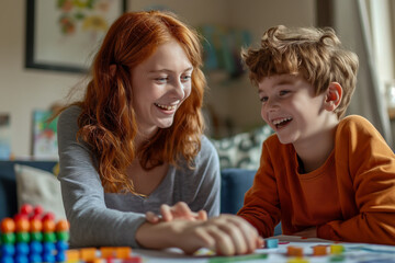 Naklejka premium A joyful autistic boy engaging in therapy with a school tutor, learning and having fun together. Capturing the essence of special education, support, and positive development.
