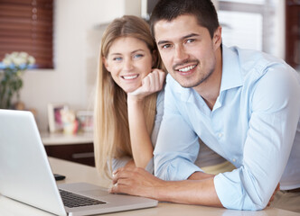 Couple, portrait and laptop for home planning, insurance and online shopping in kitchen with smile. People on computer for e commerce software, registration or FAQ on website with house internet