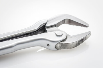 Obraz premium Close up of pliers on white surface with jaws and metal construction. Generative AI