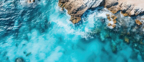 Bird s eye view of a tropical seascape with rocky terrain and vibrant turquoise waters ideal for a copy space image