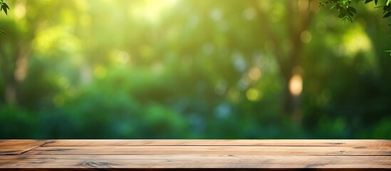 Blurred green background with a wooden table top for copy space image