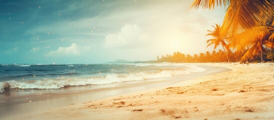 Blurry tropical beach scene with bokeh light waves and vintage color tones creating a summer background ideal for outdoor holiday and travel concepts with ample copy space image