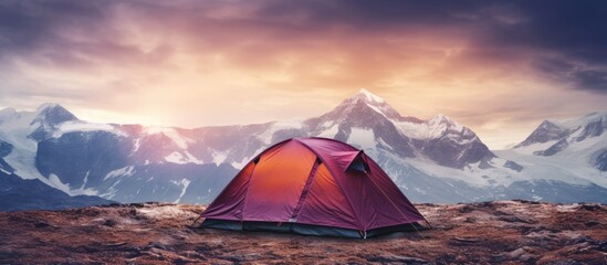 Beautiful mountain backdrop behind a tent with a copy space image included
