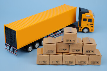 Cargo truck with carton boxes on blue background. Delivery concept.	