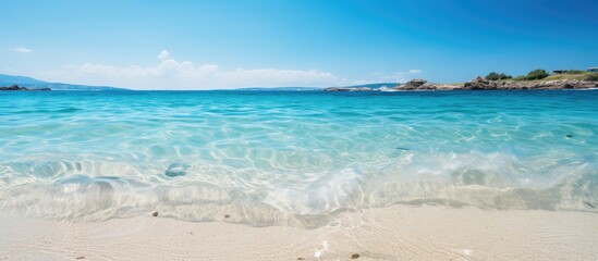 Obraz premium Blurry blue sea background on a coastal island with a summer holiday vibe for copy space image