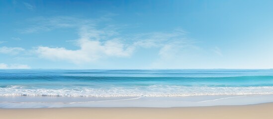 Obraz premium A serene beach scene with a tranquil ocean under a clear sunny sky ideal for a copy space image