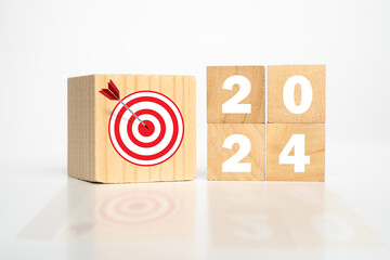 2024 Year wooden cubes with dart and target icon. Goal, Target, Resolution, strategy.